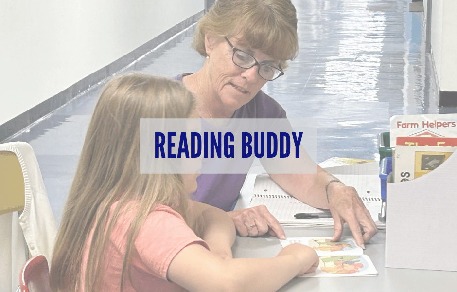 A reading buddy meets with a student